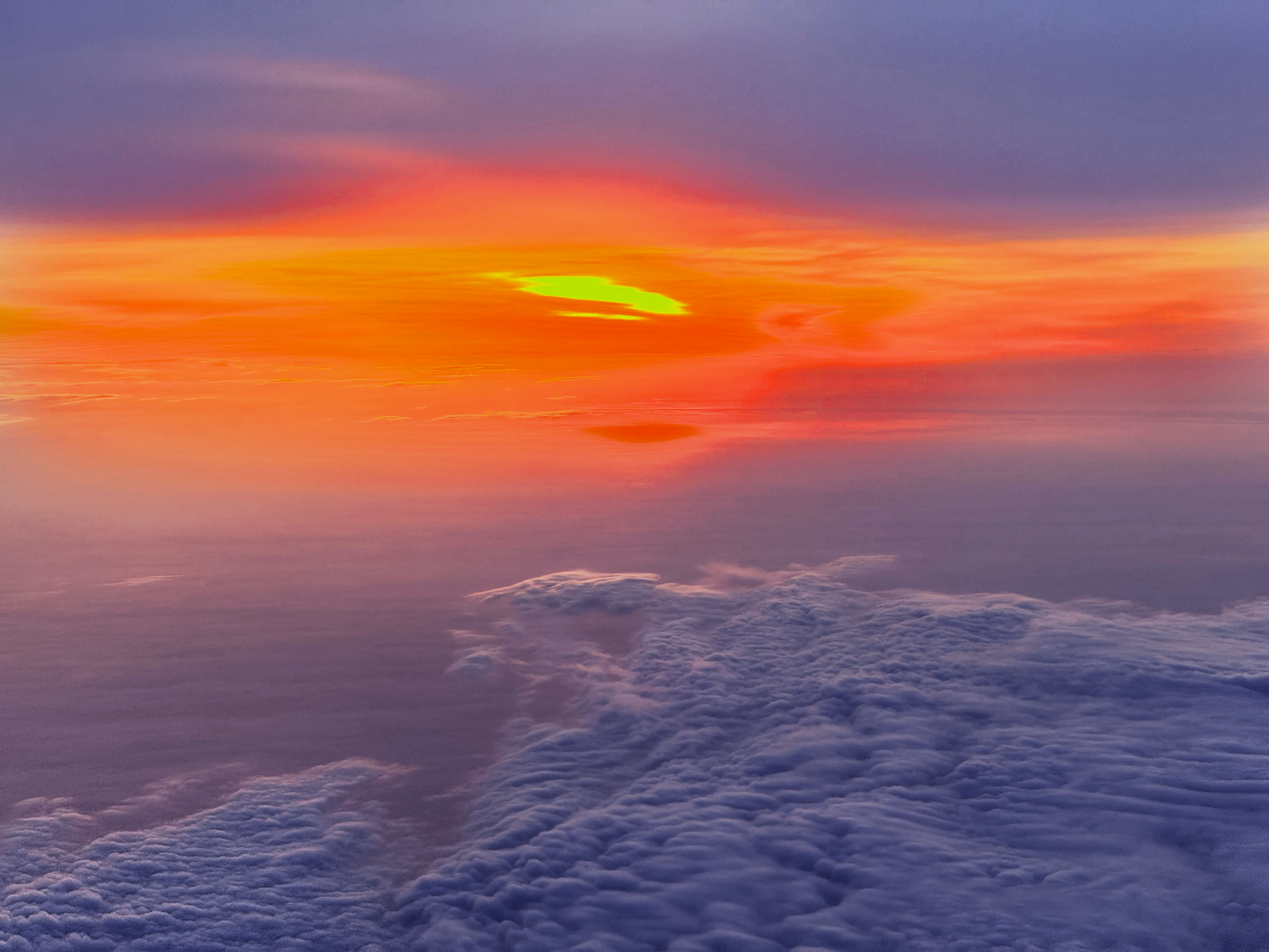 Vibrant Sunset Above Clouds